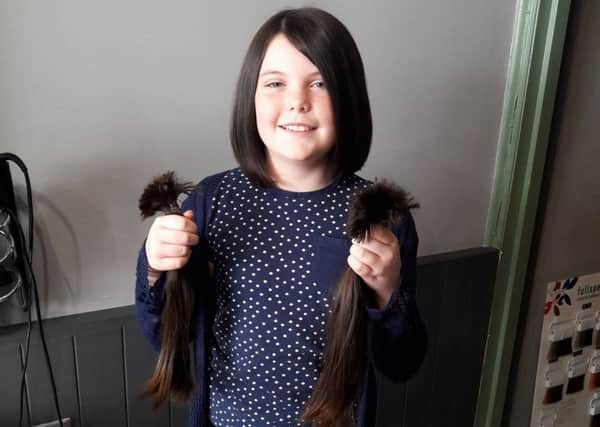 Holly had 12 inches of hair cut off for the Little Princess Trust