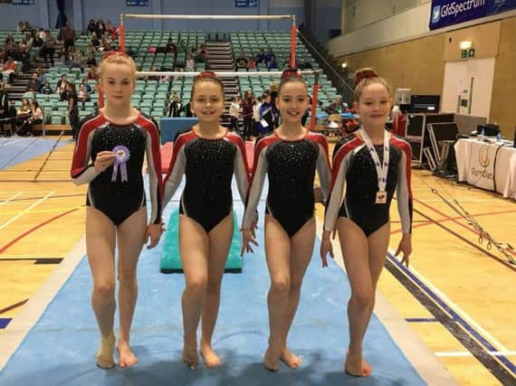 The Academy of Gym (TAG). Daisy Evans (left) and Jessica Jameson (right) have qualified for a national level competition. BBBINkodcw_MhQu4gKKA