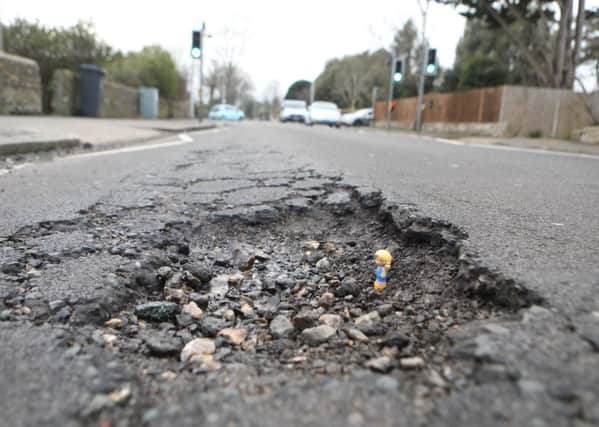 A pothole in West Sussex pictured by Eddie Mitchell SUS-180327-091839001