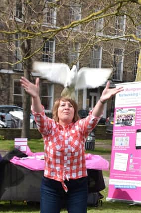 Mumpreneur Debbie Stevens releasing a dove. Picture: Kate Henwood Photography