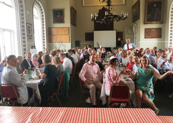 Guests, including MP Nick Herbert, front centre, and organiser Andy Batty, rear standing, at Arundel Town Hall enjoying the Feast of St George