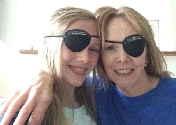 Louise Stokes with her daughter Abi celebrating 'Eye Patch Day' SUS-180424-163944001