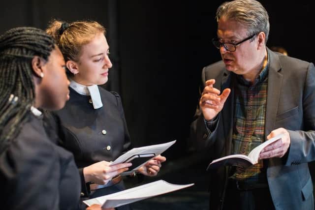 Roger Allam (right) works with two pupils