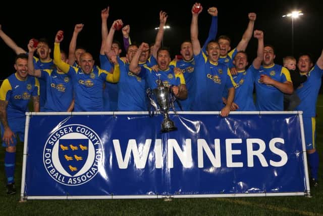 Rustington celebrate their Sussex Intermediate Challenge Cup win. Picture by Simon Roe Photography