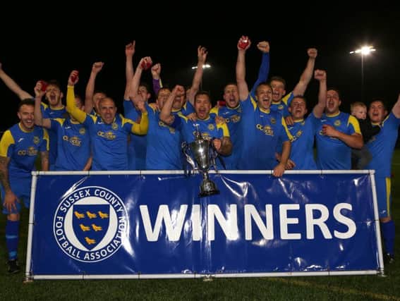 Rustington celebrate their Sussex Intermediate Challenge Cup win. Picture by Simon Roe Photography