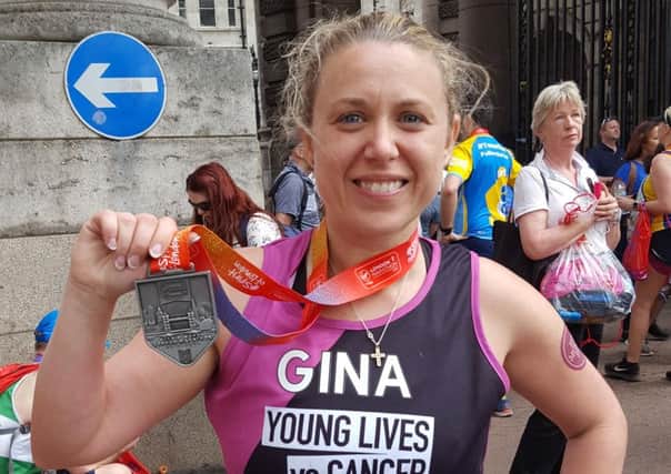 Gina completed the marathon in 5 hours 23 minutes