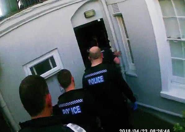 Police raid a house in Brighton (Photograph: Sussex Police)