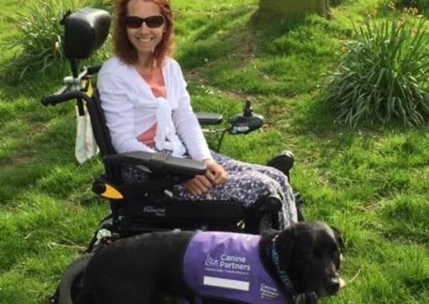 Kerenza Holzman pictured with  her assistance dog Whisky