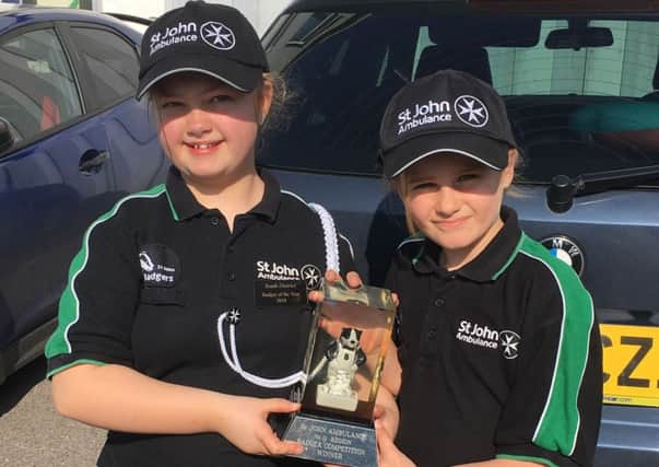 Jessica Redgrave, left, and Ella Munday with their trophy