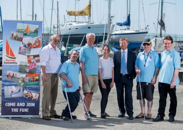 Sussex Community Foundation programme manager Hannah Clay and Rampion Offshore Wind Farm development and stakeholder manager Chris Tomlinson, centre, with Sussex Yacht Club director David Carroll and, from left, Patrick Soulijaert, Adrian Cumberworth, Tony McCoy and Oliver Forsyth from Sussex Sailability. Picture: Darren Cool