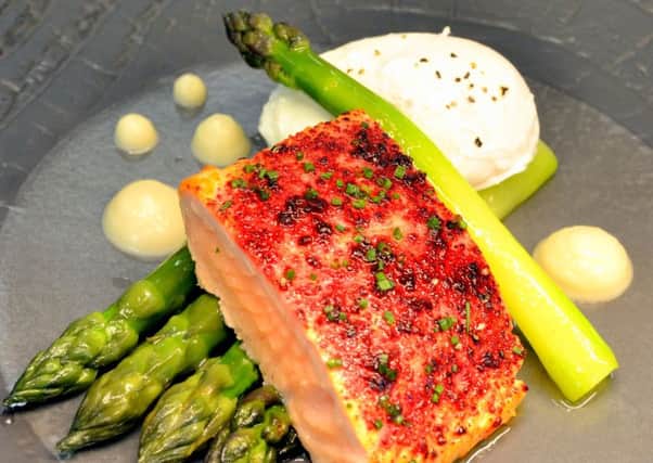 Salmon fillet with beetroot powder, asparagus and poached egg