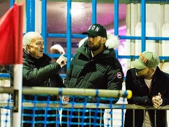 Brighton defender Shane Duffy (right) chats with Shoreham manager Sammy Donnelly (left) at Middle Road last night. Picture by David Jeffery