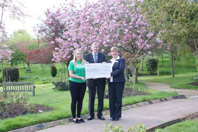 L-R Lizzie Armstrong receives the cheque from Cllr Shuttleworth and Gill Steadman SUS-180426-125951001
