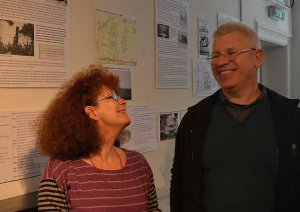 Yvonne Cleland and Julian Porter by the exhibition SUS-180305-123556001
