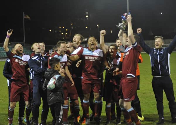 Little Common Football Club celebrates with the Southern Combination League Division One Challenge Cup. Pictures by Simon Newstead