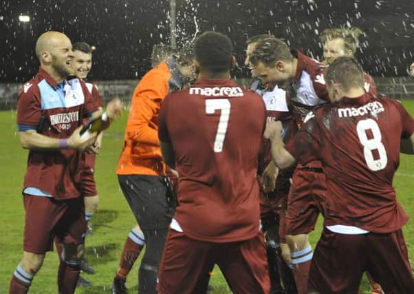 Little Common celebrate their cup final victory last night. Picture by Simon Newstead