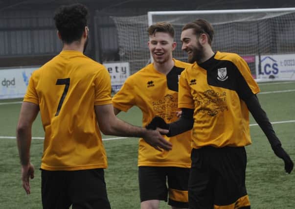 Bexhill United celebrate scoring during their 3-1 win away to Langney Wanderers in March. Picture by Simon Newstead
