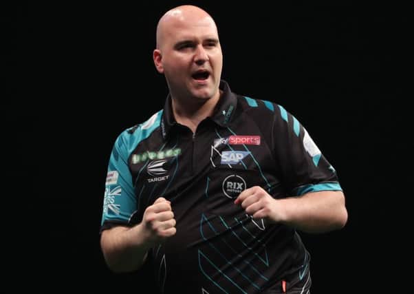 Rob Cross celebrates during his 6-6 draw against Raymond van Barneveld. Picture courtesy Lawrence Lustig/PDC