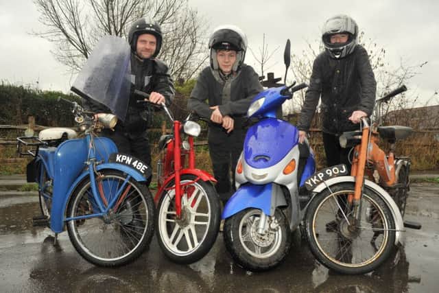 Jordan (middle) with members of the South East Moped Enthusiasts Group
