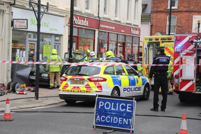 Emergency services at the scene of the collision in Montague Street in Worthing.Photo by Eddie Mitchell. SUS-180428-143303001