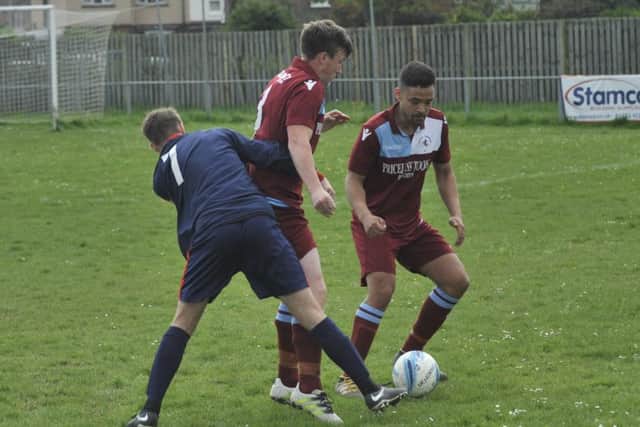 Little Common pair Louis Walker and Charlie Bachellier combine to crowd out Billingshurst player Jamie Bennett.