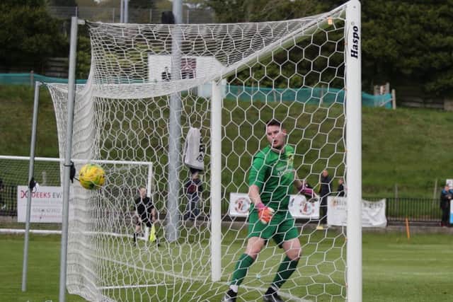 Sittingbourne goalkeeper Harry Brooks is beaten for the Hastings goal. Picture courtesy Scott White