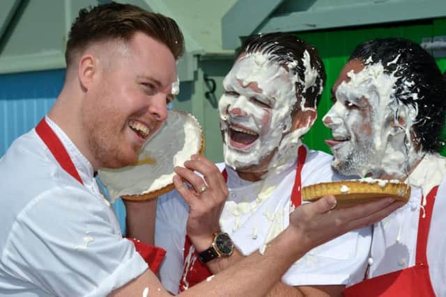 Steven Edwards, Kenny Tutt and Matt Gillan try out the cream pie throwing competition