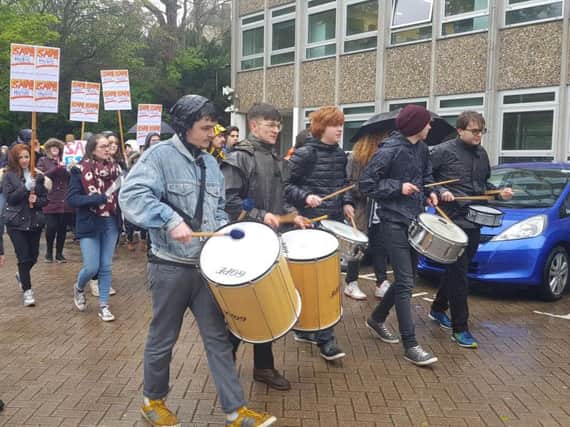 Students protest against cuts to the East Sussex Music Service outside Lewes' County Hall