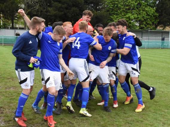 Heath celebrate winning the league on Saturday. Picture by Grahame Lehkyj