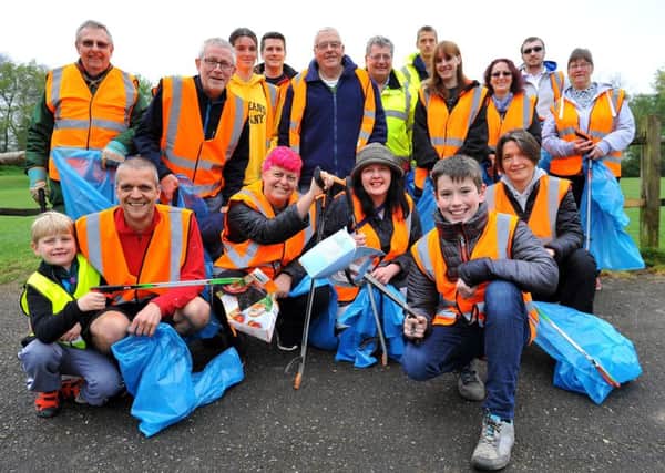 The clean-up crew in Franklands Village on Saturday. Picture: Steve Robards