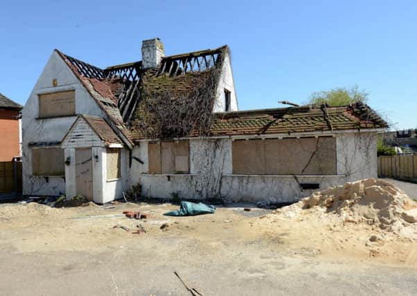 The existing burned-out building in Lancing