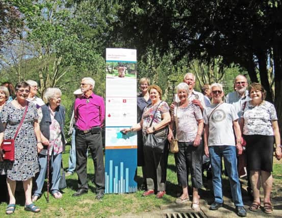 Members of Worthing Twinning Association with the plaque celebrating the twinning