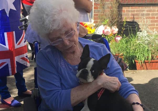 Darlington Court resident Kathleen Tapp with Ruby the Boston terrier