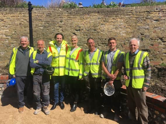 Landscaping staff and Hailsham Roadways officials at the Peace Garden at the Wish Tower SUS-180105-160057001