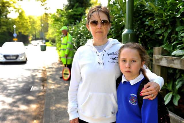 Elaine Boys is concerned for the safety of school children and the lollipop man Mick Bassett in Thakeham after her daughter Yasmin was almost knocked down by a driver last week.