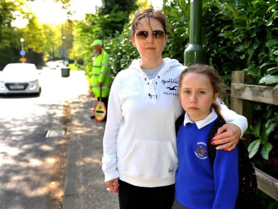 Elaine Boys is concerned for the safety of school children and the lollipop man Mick Bassett in Thakeham after her daughter Yasmin was almost knocked down by a driver last week.