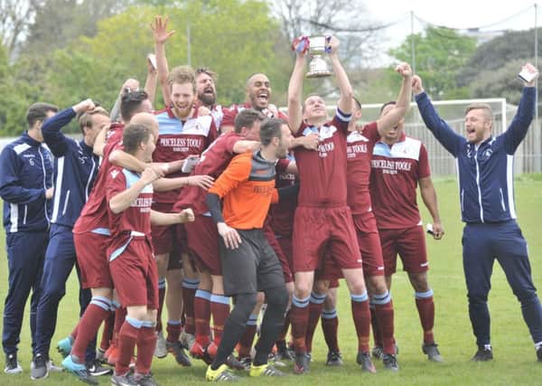Little Common Football Club celebrates with the Macron Store Southern Combination League Division One trophy. Picture by Simon Newstead