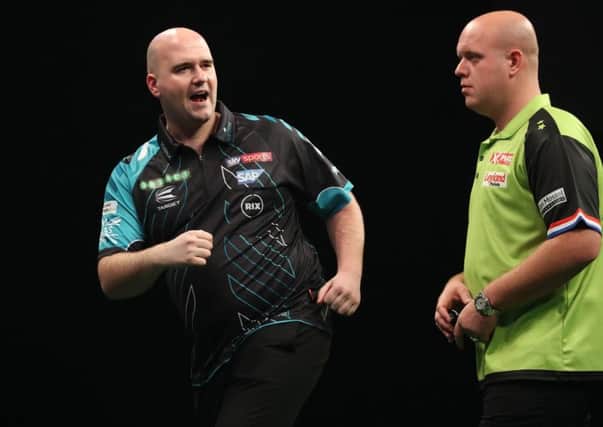 Rob Cross celebrates a successful dart during his previous Unibet Premier League meeting with Michael van Gerwen on night one in Dublin. Picture courtesy Lawrence Lustig/PDC