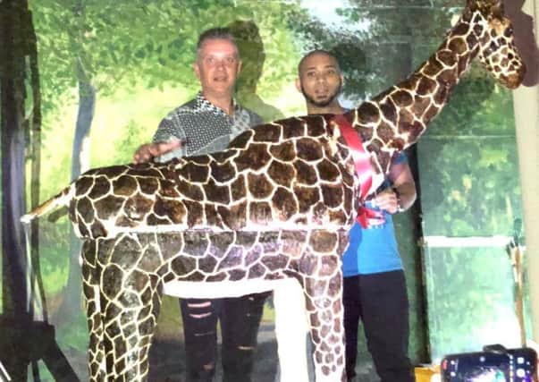 Sue Sayers made this 7ft giraffe cake for her friend Mark, (pictured left).