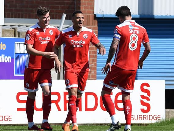 Crawley Town's Karlan-Ahearne Grant is congratulated by team-mates Josh Doherty and Jimmy Smith after taking the lead for Reds during their 1-1 draw at Mansfield Town with his seventh-minute goal.
Picture by Andrew Roe
