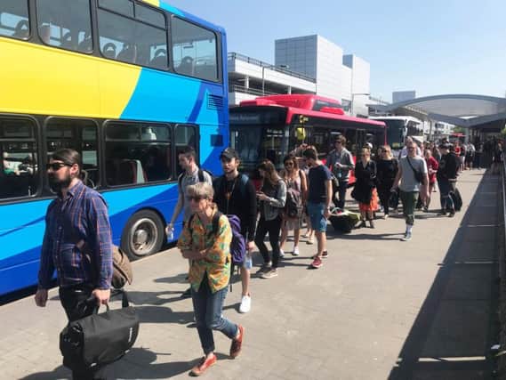 Hundreds queued in the hot sun at Gatwick Airport to wait for replacement bus services