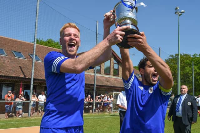 Tom Graves and Naim Rouane lift the trophy. Picture by PW Sporting Photography