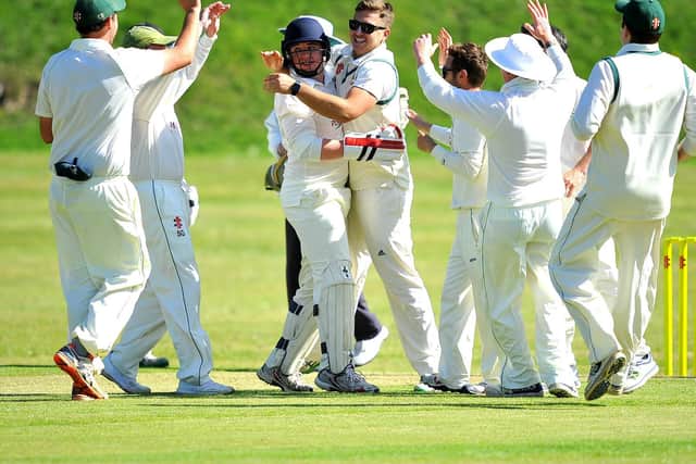 Heath celebrate the wicket of Ryan Maskell. Picture by Steve Robards