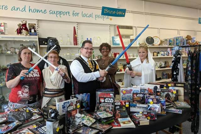 Billy Blanchard-Cooper with the Wick St Barnabas shop staff on Star Wars Day