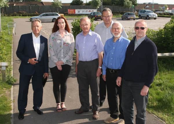 Roger Elkins, far left, and affected residents by the site where the proposed ASDA petrol station would be. Picture: Derek Martin