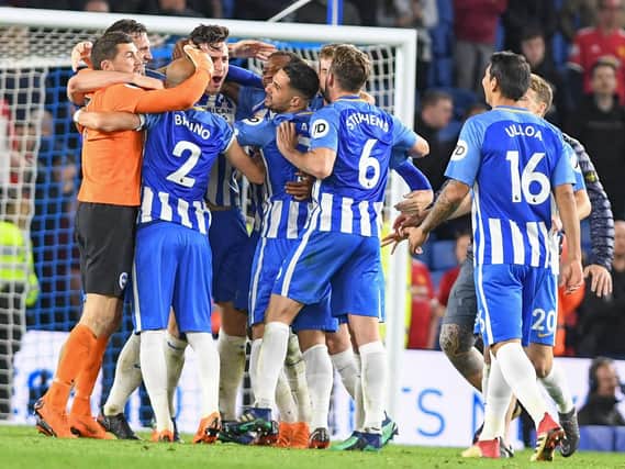 Albion players celebrate beating Manchester United. Picture by Phil Westlake (PW Sporting Photography)