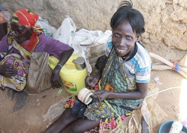 Resident of the Pokot region using her hadicraft skills to make items to sell SUS-180905-120822001