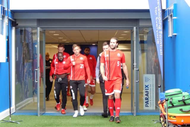 Reds players emerge from the tunnel on to the pitch at the Amex