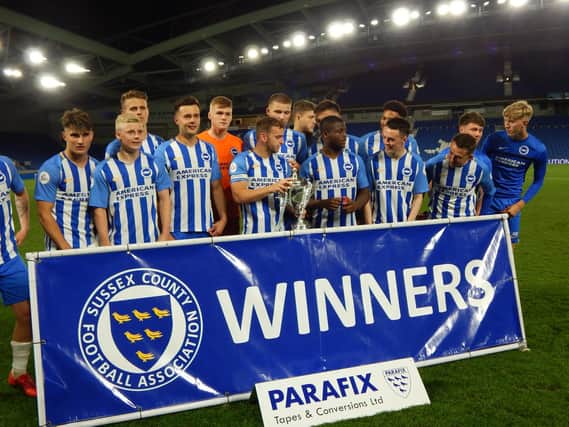 Brighton players celebrate winning the Senior Cup