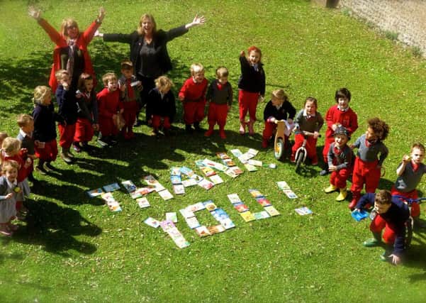 The pre-prep children helped create giant words of appreciation, written in books